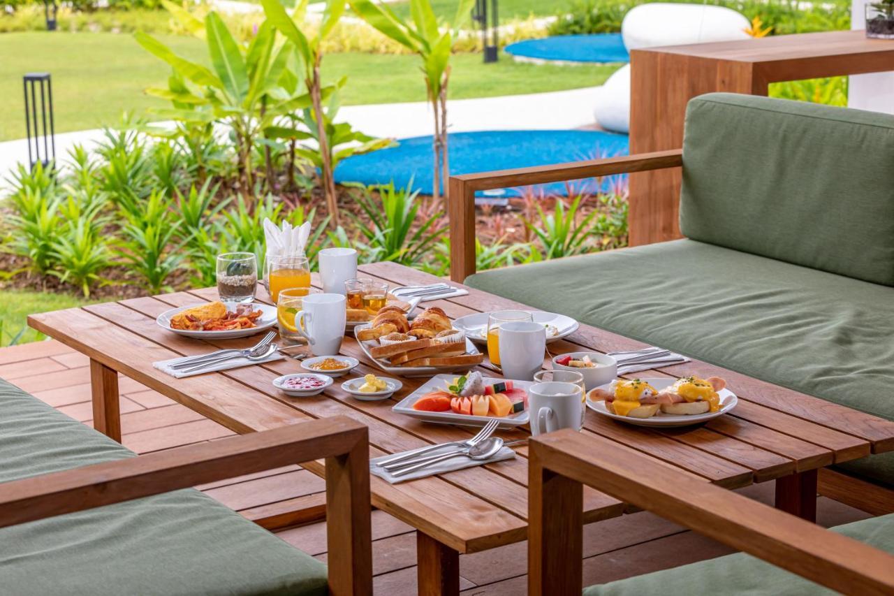 Outrigger Khao Lak Beach Resort - Sha Extra Plus Экстерьер фото A breakfast table