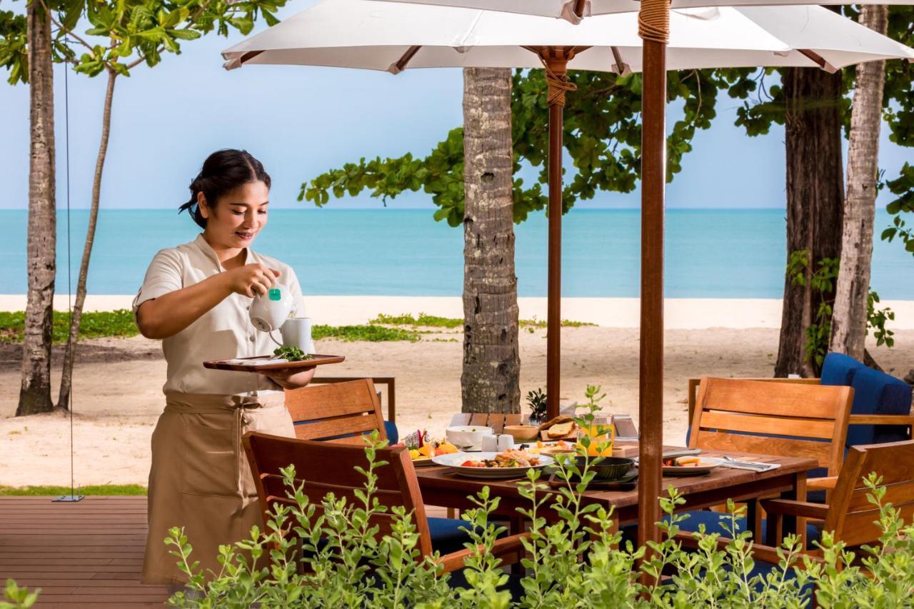 Outrigger Khao Lak Beach Resort - Sha Extra Plus Экстерьер фото A Thai waitress at a resort